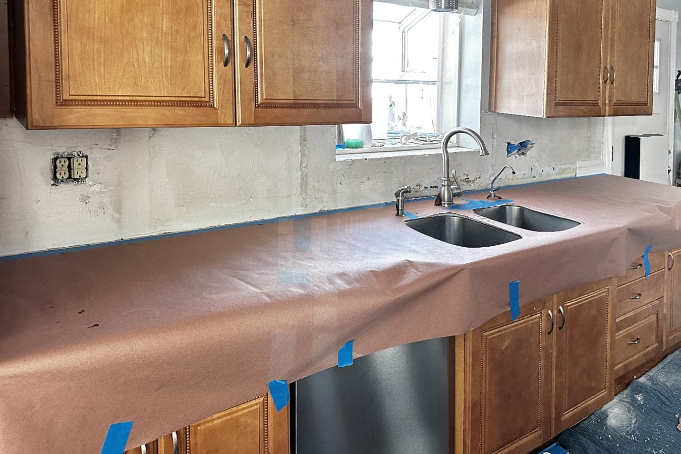 preparing to install tiles in the kitchen backsplash
